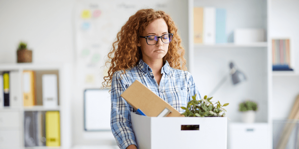 Employee leaving with a box of belongings